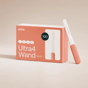 A Mira Ultra4 Kit box with a single Mira Hormone Monitor testing wand placed next to it on a light, neutral background. , Kiara Health Fertility