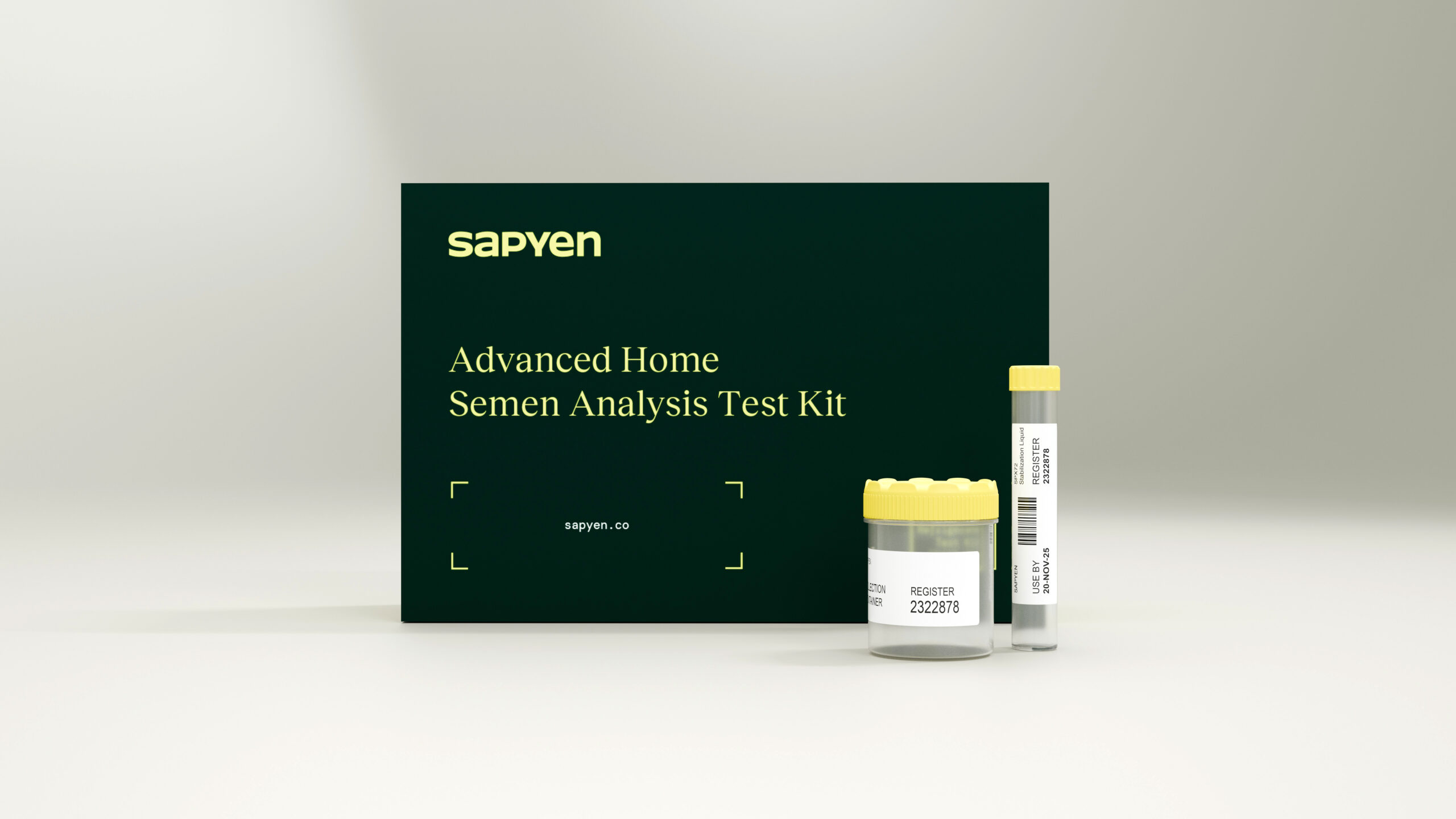 A home semen analysis test kit by Sapyen is displayed with a black box, a specimen cup, and a sample vial with yellow lids on a plain background. , Kiara Health Fertility