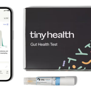 A Tiny Health Gut Health Test kit, a sample collection tube, and a smartphone displaying Adult Gut Health Test results with a score of 63 on a graph. , Kiara Health Fertility